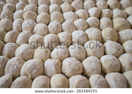 Fresh dough ready for baking. Small balls of fresh homemade pizza dough