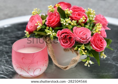flower vase with beautiful red flowers. artificial flowers.
