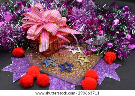 luxury Christmas gifts box wrap with a pink ribbon and a bow