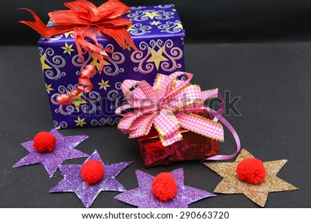 luxury Christmas gifts box wrap with a pink ribbon and a bow