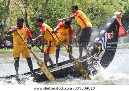 CHAMPAKULAM, INDIA - JULY 01: largest team sport, men wearing traditional dress participate at the Champakulam vallam kali (snake boat race) on July 01, 2015 in Alappuzha, Kerala, India. Festival Onam