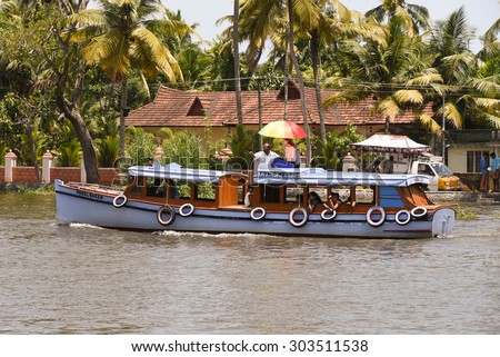 ALLEPPEY, INDIA -JUL 01 : Unidentified people enjoying boat race in the backwaters on July 01, 2015 in Alleppey, Kerala India. People of the region depend on boats for their transporting needs.