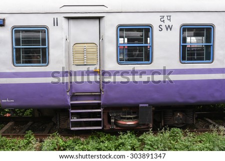 Indian railway,Trains at train station. Kerala, India. door of train with steps purple color.