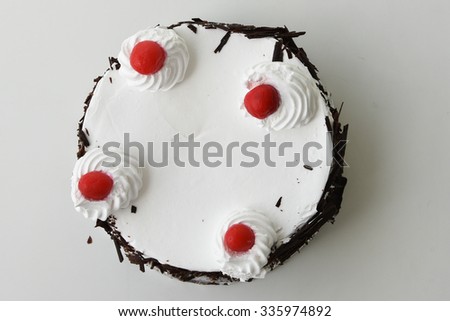 Black forest cake decorated with whipped cream and cherries. Isolated on white background. piece of cake. Girl cutting a cake for Christmas. Christmas cake