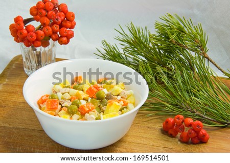 salad in a bowl with ash and pine