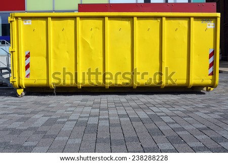 yellow industrial garbage skip