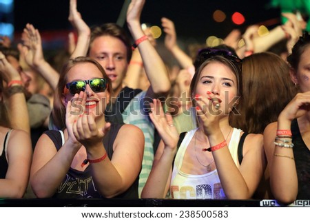FERROPOLIS, GERMANY - JULY 18, 2014: Clapping concert crowd in front of a stage at MELT Festival on July 18, 2014 in Ferropolis.