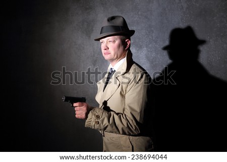 vintage agent pointing a handgun in the dark