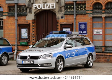 HAMBURG, GERMANY - JUNE 1, 2013: A German police car in front of the Hafencity police station featured in the German TV series \'Notruf Hafenkante\' on June 1, 2013 in Hamburg.