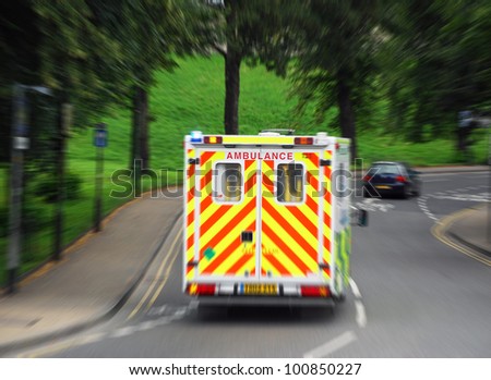 View of ambulance reacting to 999 call. Zoom blur added for effect.