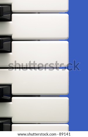 Close up of midi keyboard on blue background.