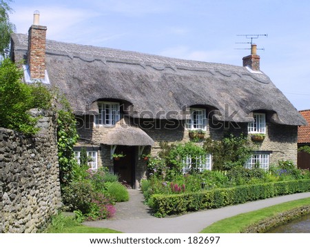 English thatched cottage at Thornton Dale, Yorkshire, England, UK.
