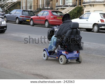 stock-photo-old-person-using-electric-wheel-chair-242063.jpg