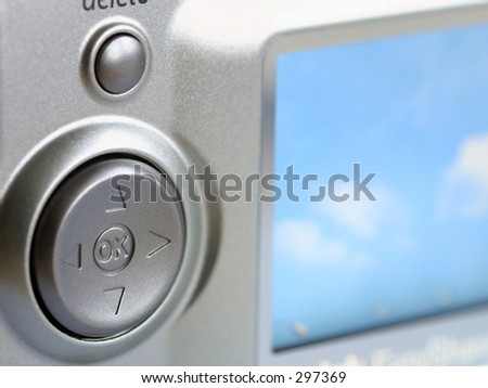 Digital camera arrow control used with menus and playback.