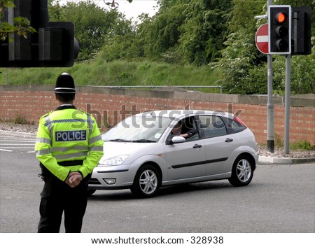British Policeman watches traffic in York, UK.