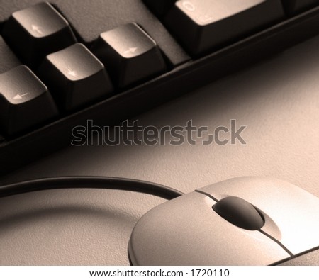 Keyboard and mouse in sepia tones