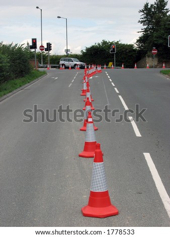Road cones channeling traffic at road junction