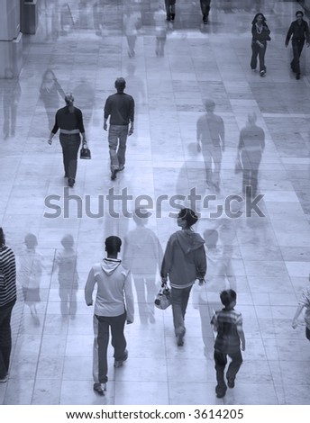 Surreal image of people in shopping mall. Overlaid with faded image for effect.