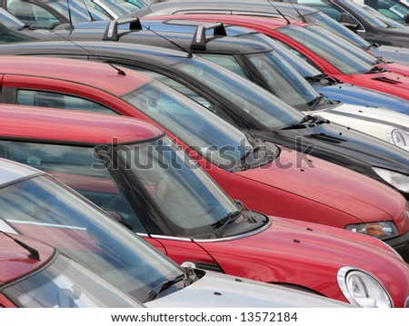 View of tightly packed cars in parking lot