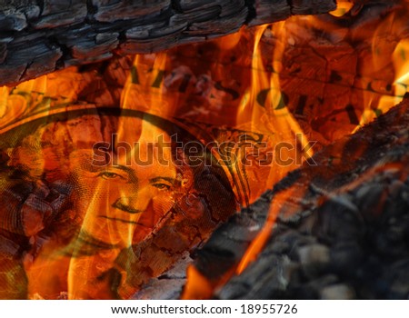 Close-up of flames burning the American Dollar