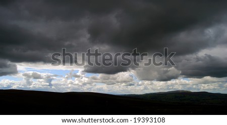 Dark stormy clouds hang over Yorkshire Dales landscape