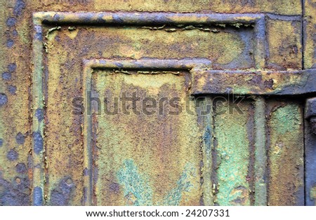Close-up of old rusty metal cabinet door with flaking paint