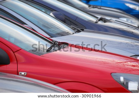 Telephoto view of cars parked in car park
