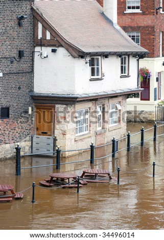 Flooded waters from River Ouse surround riverside pub in York.