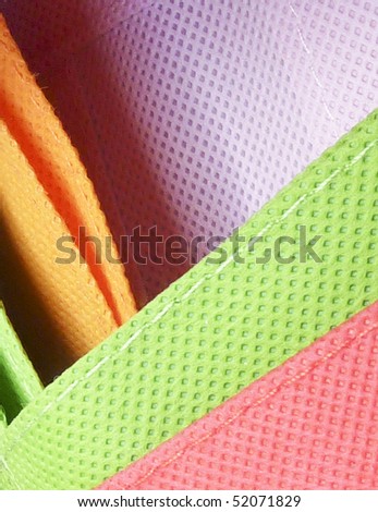 Closeup of texture on coloured shopping bags
