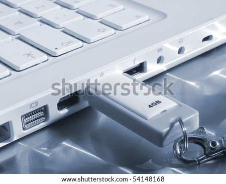 Closeup of memory stick in laptop computer (blue tone)