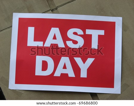 Last day sign on wind of store which was closing down