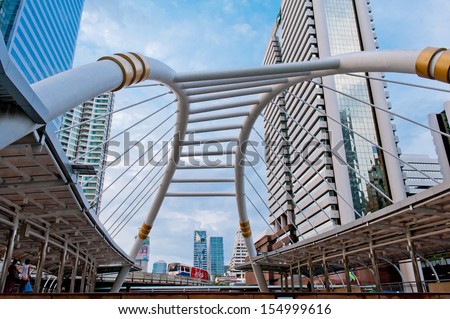 BANGKOK - May 20: Public sky walk architecture like a spider for transit between Sky Transit and Bus Rapid Transit Systems at Sathorn-Narathiwas junction on May 20, 2013 in Bangkok, Thailand.