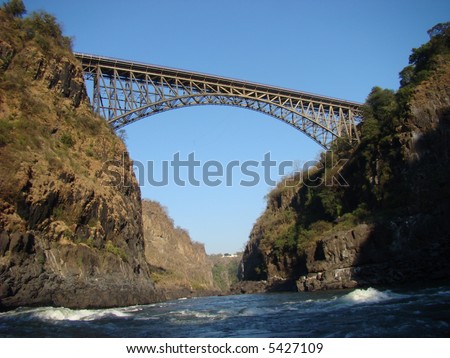 Bridge over the Zambezi River connecting Zambia and Zimbabwe at Victoria Falls. Location of the highest commercial bungee jump in the world.