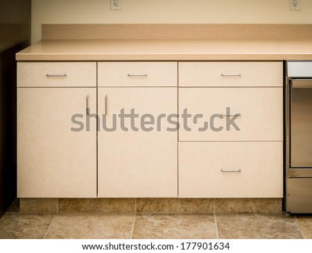 Empty tan kitchen counter and cabinet minimalist style