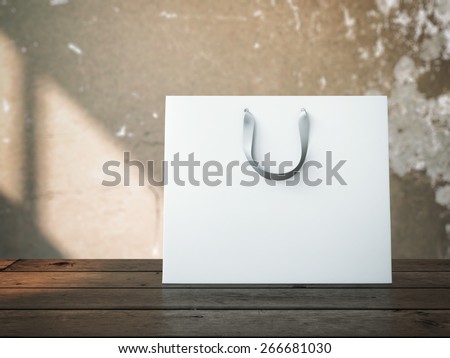 Shopping bag on wooden table