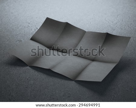 Black folded sheet of paper