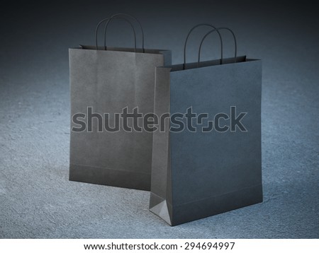 Two black paper bags with handles