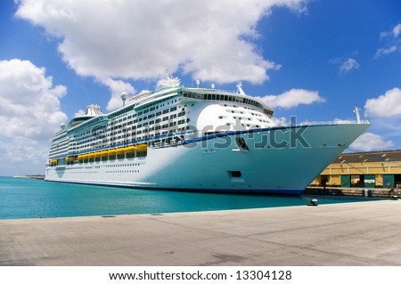 cruise ship anchored in a caribbean pier