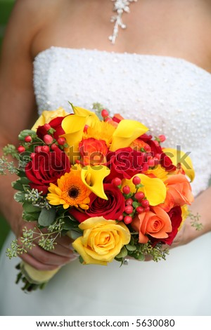 Bride is holding beautiful colorful bouquet