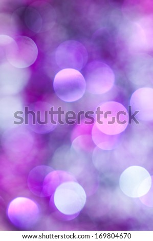 Purple Lights Festive background. Abstract bright background with bokeh defocused purple lights