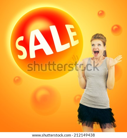 the girl surprised and happy with big eyes and hands apart in the direction looks at the bubble with the word sale on a bright background for advertising, banner and printing
