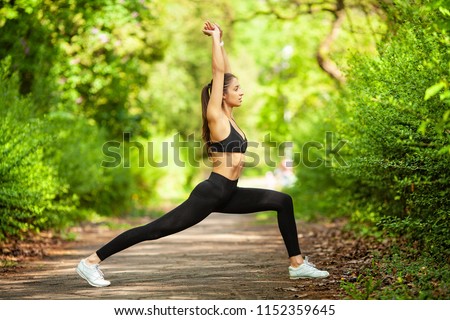 Fitness. Athlete girl, thlete exercise at outside, woman fitness. Young Beautiful Woman Stretching In The Park .