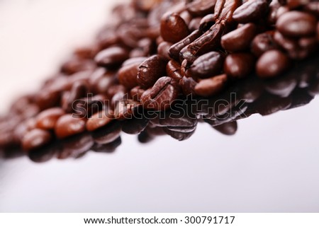 Roasted coffee beans pile from top