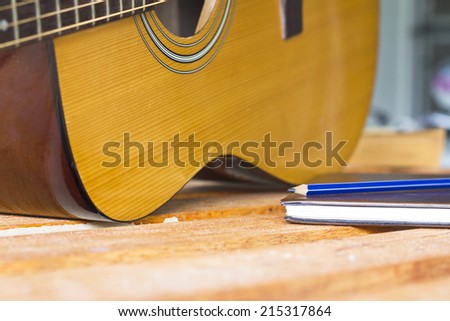 guitar and pencil for create music select focus