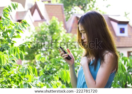 Young Women play Mobile Phone