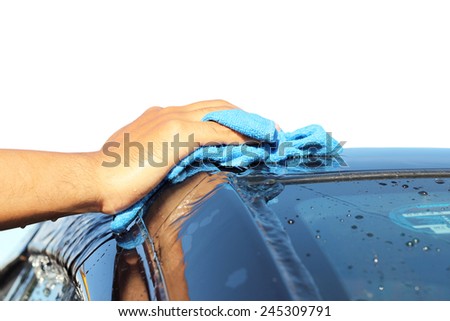 Isolated on white background. cleaning black car by hand