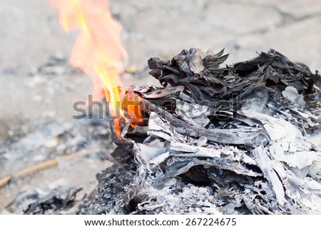 A custom in Chinese. People burn the Ghost Money and paper materials to honor the ancestor in festival so that their ancestor still can rich in heaven or hill.