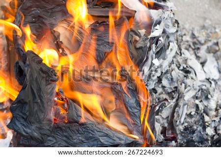 A custom in Chinese. People burn the Ghost Money and paper materials to honor the ancestor in festival so that their ancestor still can rich in heaven or hill.