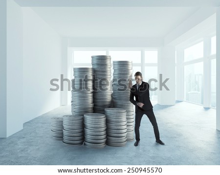 Businessman pushing coin in empty office concept