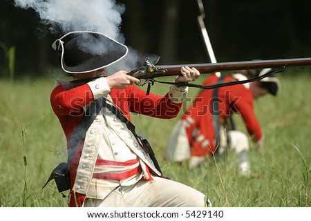 stock-photo-english-redcoat-soldier-firing-weapon-5429140.jpg